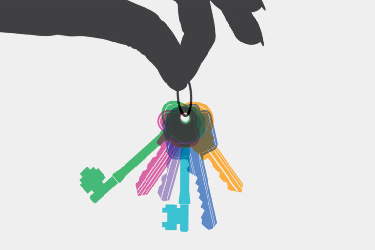 hand holding a set of multicoloured keys