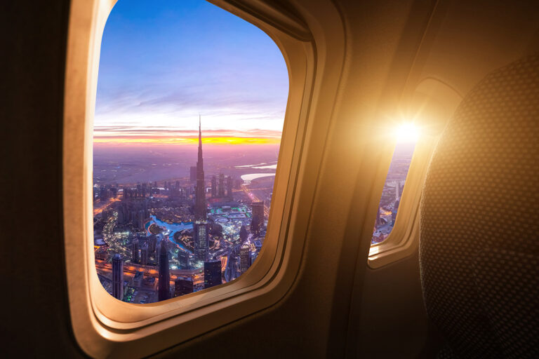 view of a budy city from an aeroplane window