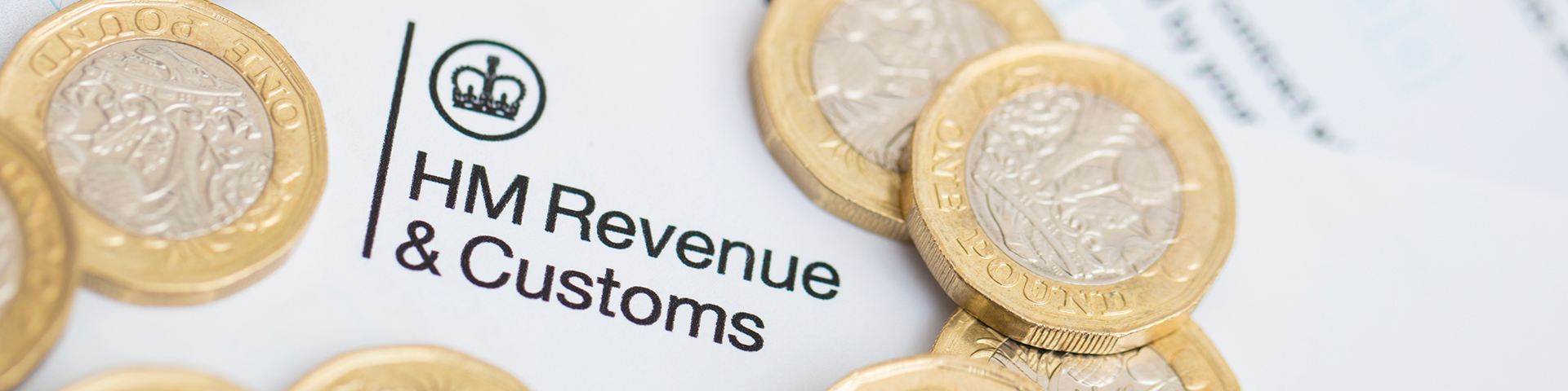 HM Revenues & customs logo surrounded by pounds coins